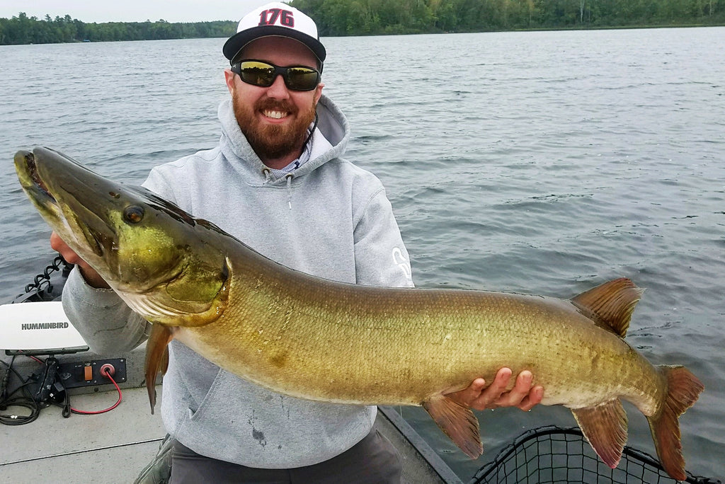 Doug Smith helps Client Matt boat 48" Fish